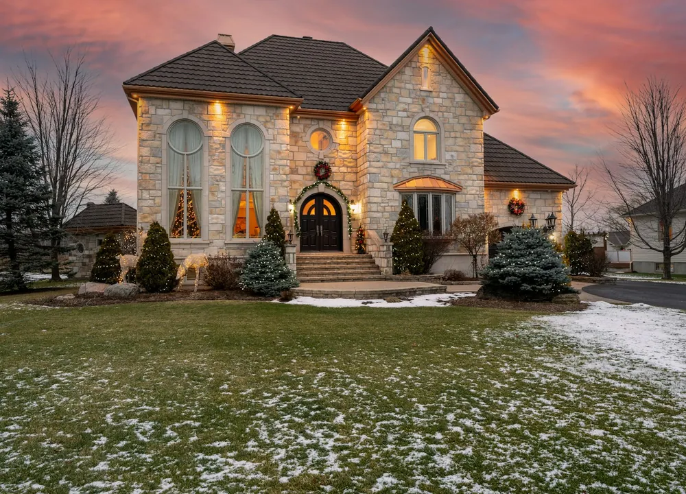 Stone chateau-style home on a winter street in Orleans